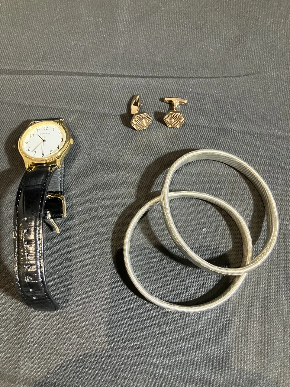 Fred Bennett cufflinks and watch worn by Mark Fleischmann