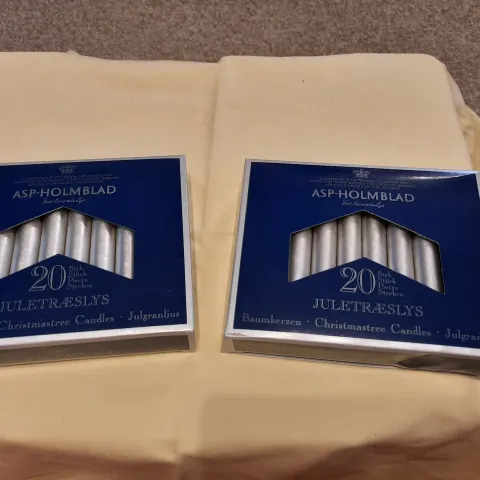 6 boxes of 10 small silver candles