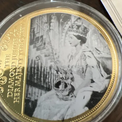 Diamond jubilee gold plated coin it comes with its own certificate of authenticity