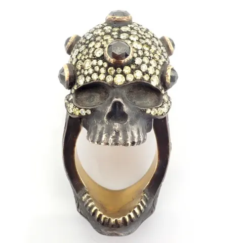 An exquisite hand-made skull  ring detailed with brilliant diamonds and gold on silver.