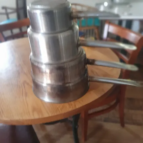 4 heavy duty shallow pots. Stainless steel.