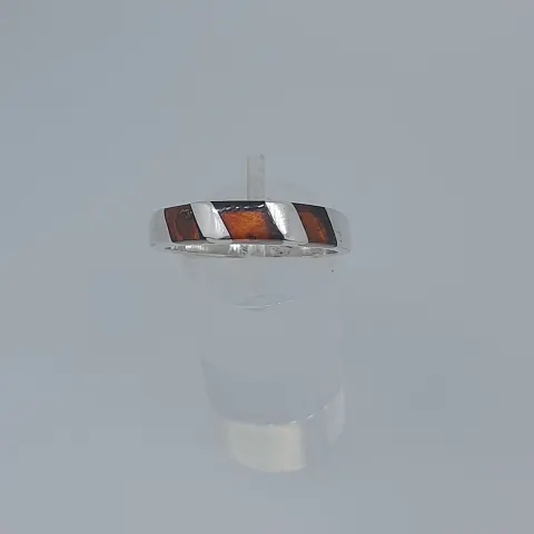 Silver ring set with natural amber