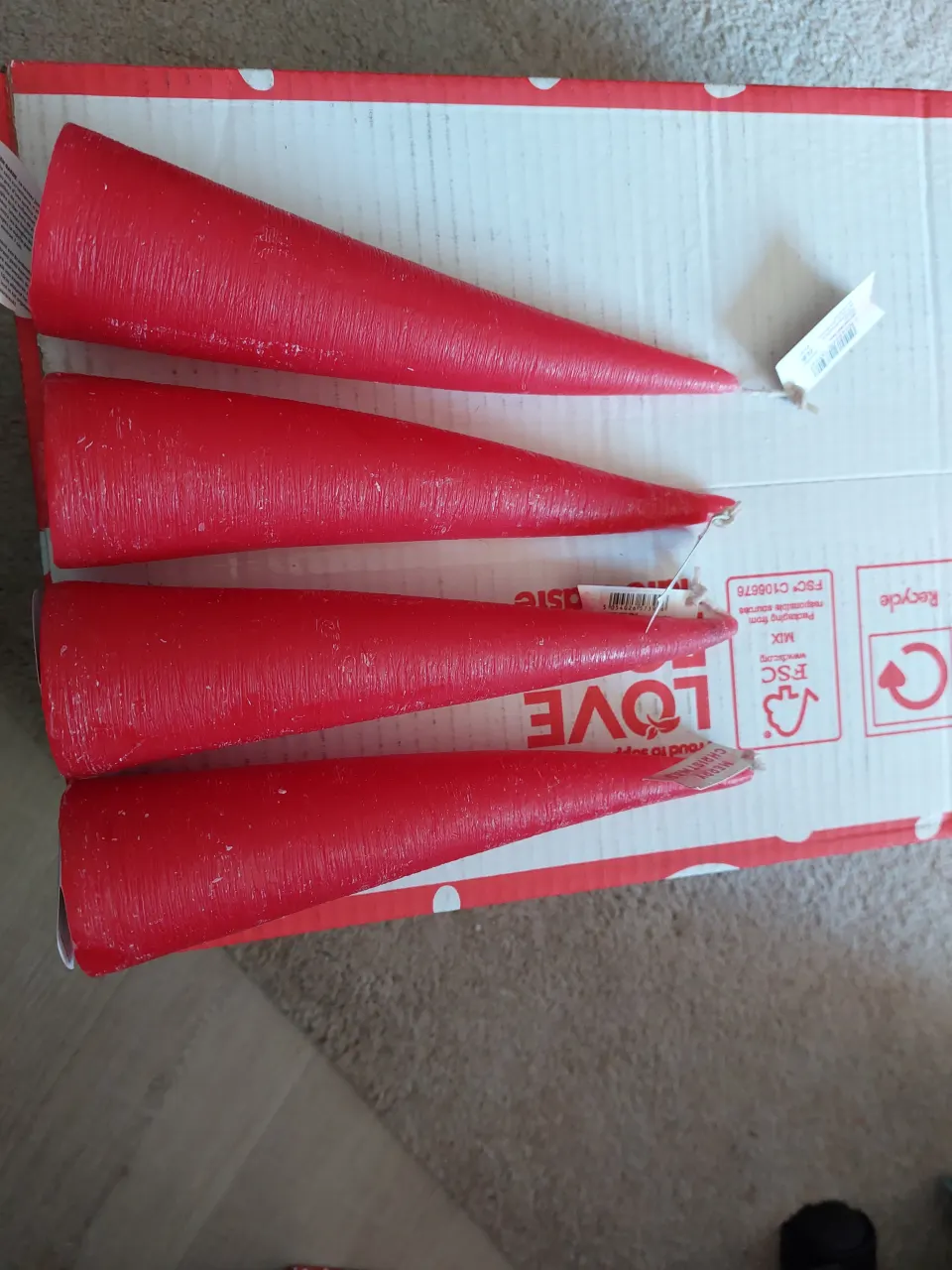 Red cone candles approx 9 inches long x 4 from Paperchase