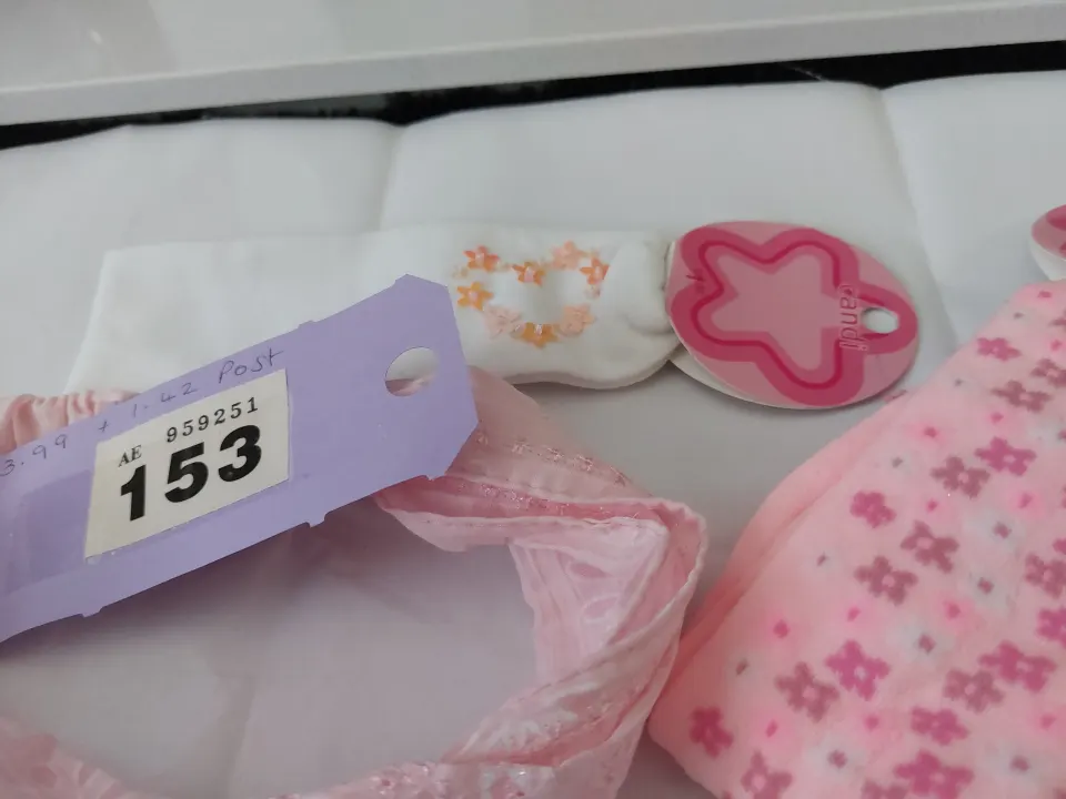Pink and white hairbands and hair accessories.  Minimum 24 items