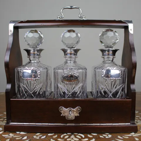 Vintage Mahogany Three Bottle Cut Crystal Tantalus with Silver Plated Mounts