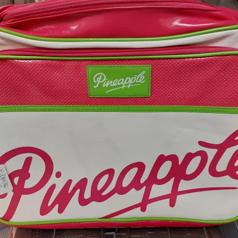 Small pink green and white bag