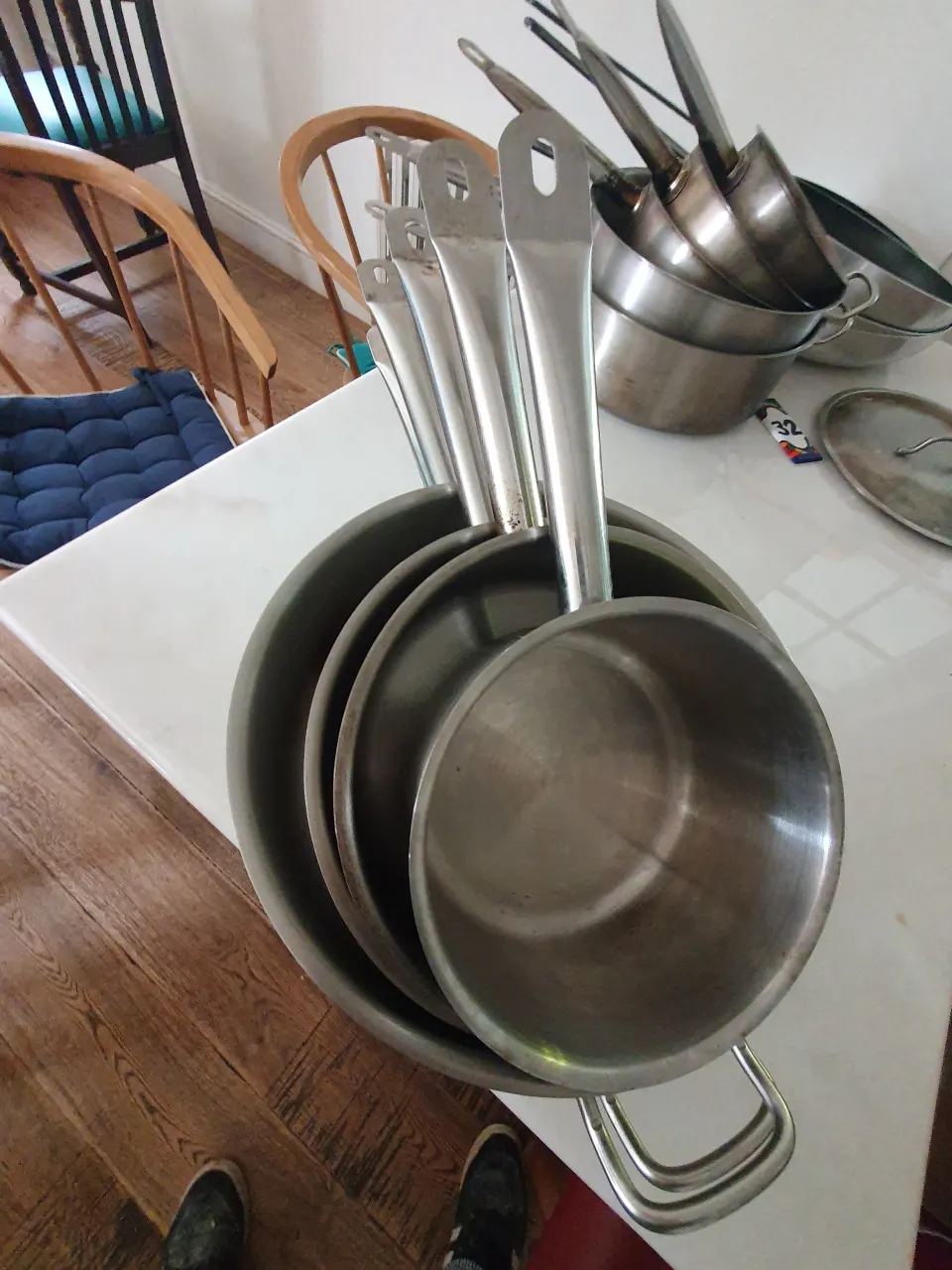 Set of 5  stainless steel, shallow pots.
