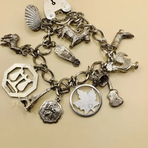 Vintage Solid Sterling Silver Charm Bracelet and Charms 39.54 12 Charms