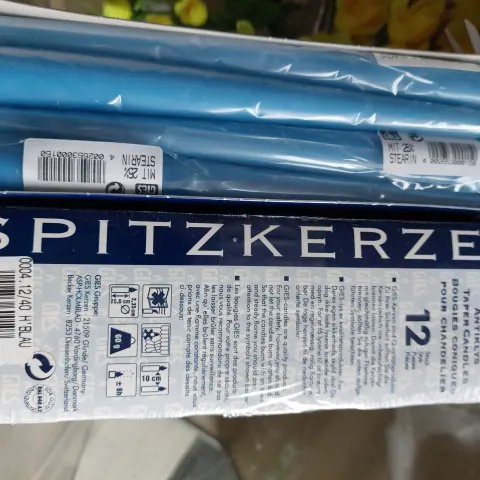 2 boxes of 12 blue candles