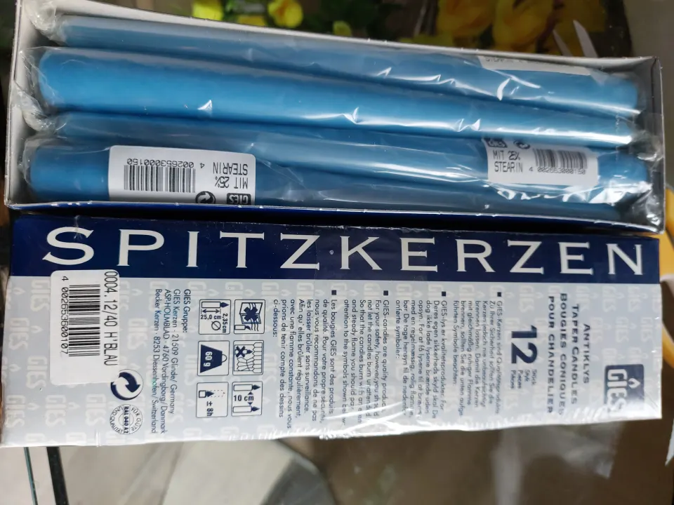 2 boxes of 12 blue candles