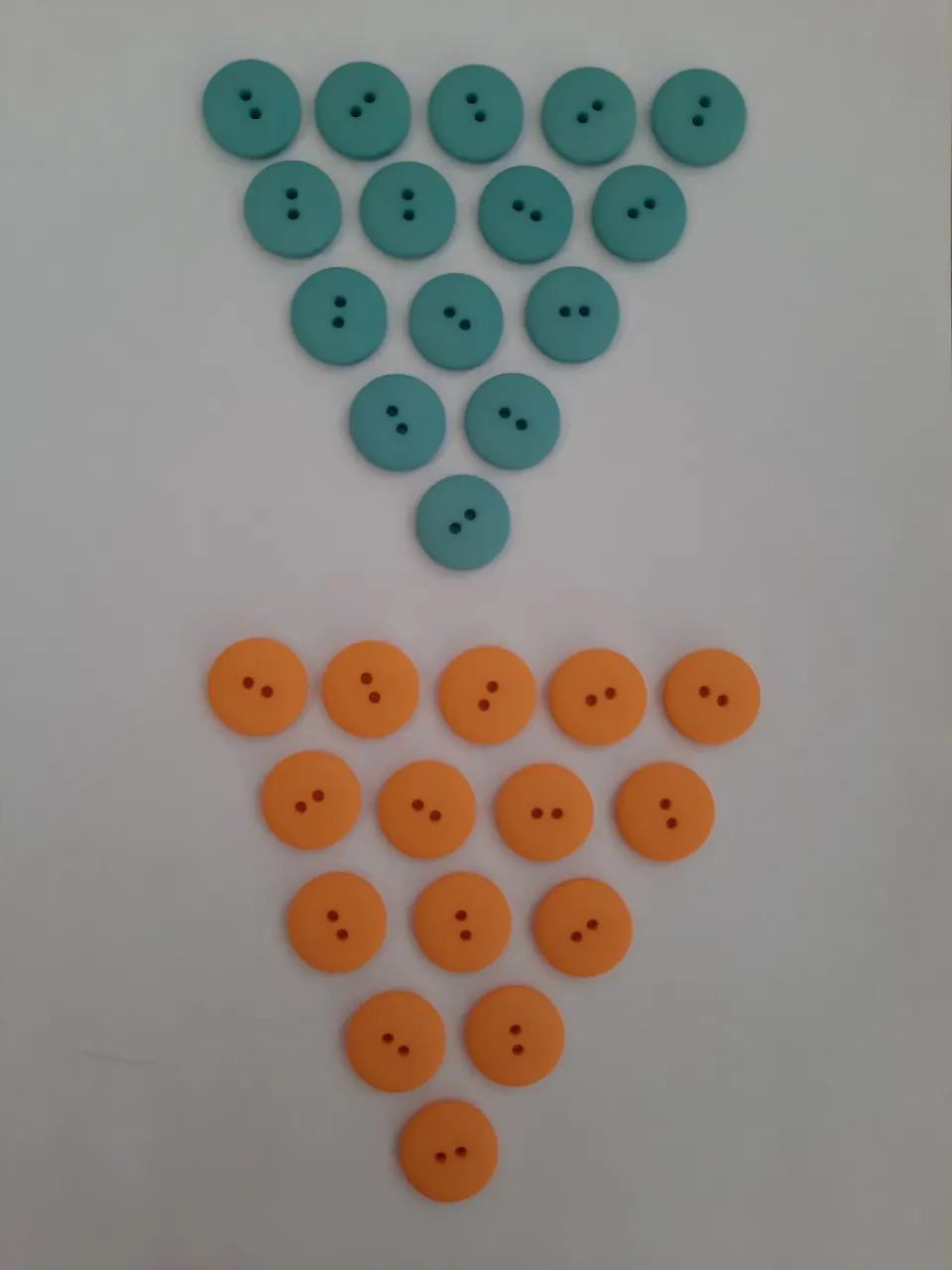Assorted buttons.   Good quality.  Pack of 120 plus bag of small wool needles to sew on