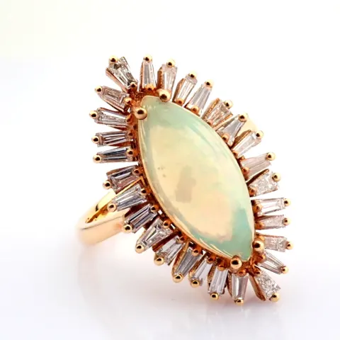 An Exquisite  18K Rose Gold Ring Detailed With Opal and Brilliant Diamonds.