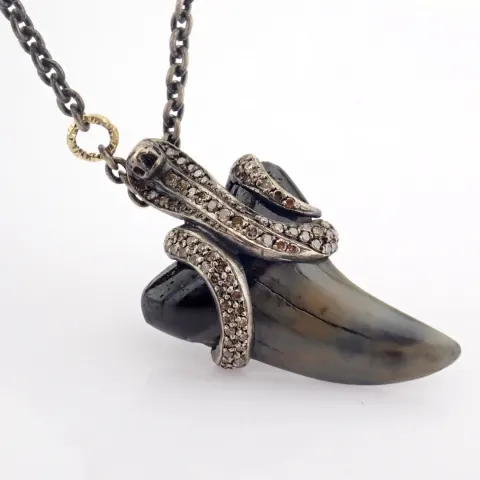 A Shark Tooth Necklace Detailed With Brilliant Diamonds and Gold On Silver.