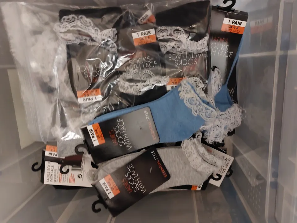 Box of 24 pairs of socks, blue, grey and black with lace edging