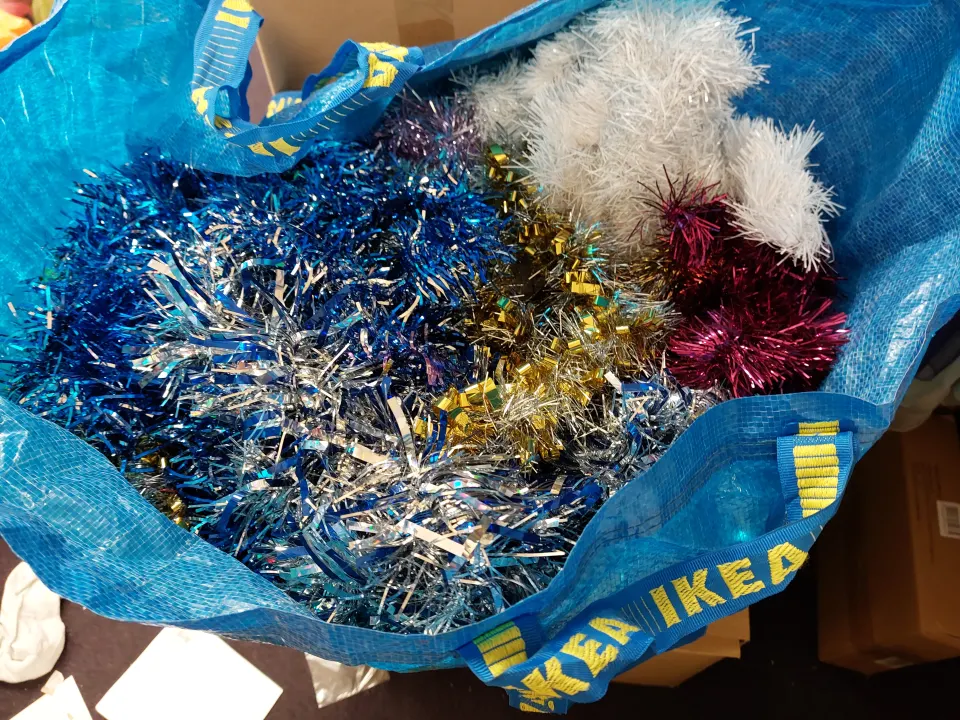 CHRISTMAS decorations and tinsel.  Large box with selection of items