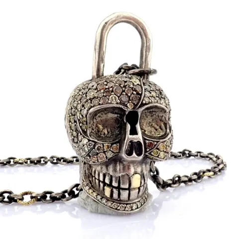 An Exquisite Convertible Clasp Skull Necklace Embellished With Gold and Diamonds On Silver