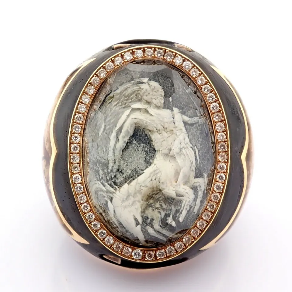 Ebony ring detailed with topaz with reversely engraved intaglio mytological centaur in center