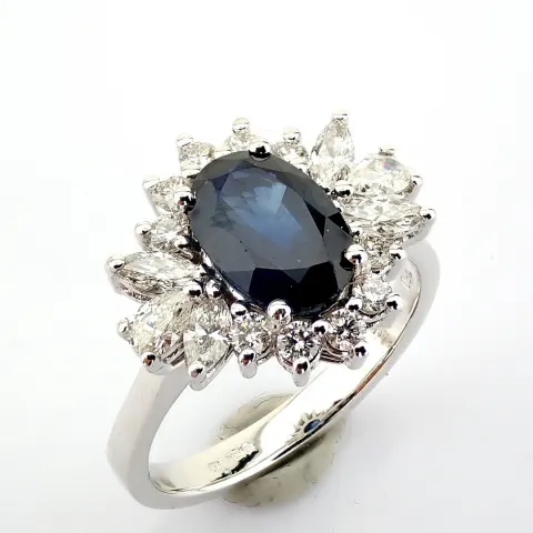 18K white gold cluster ring detailed with sapphire and diamonds