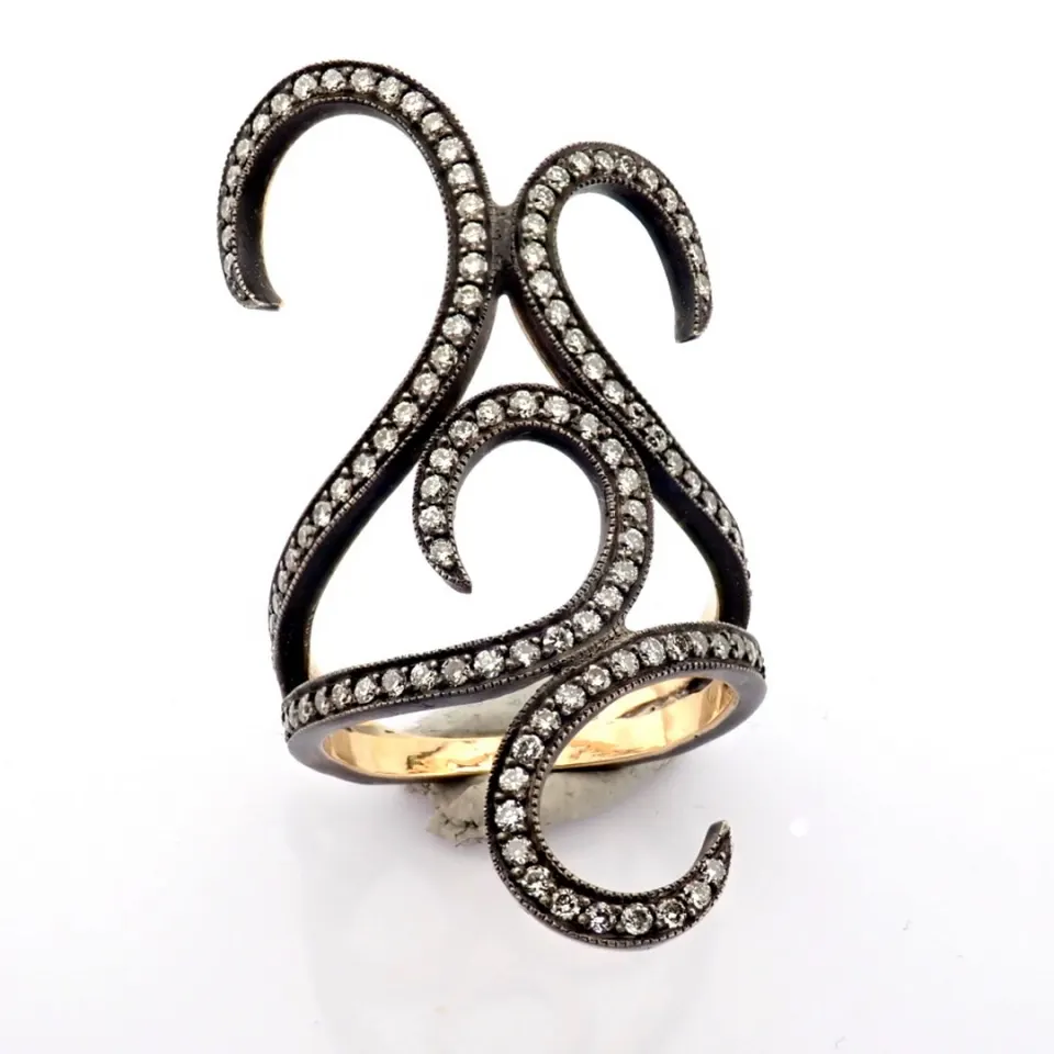 An exquisite ring detailed with brilliant diamonds and gold on silver.