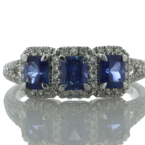 18ct White Gold Three Stone Emerald Cut Sapphire And Diamond Ring (S 1.20) 0.29 Carats