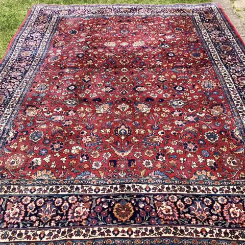 An Antique Persian Meshad Amoghli Rug Signed