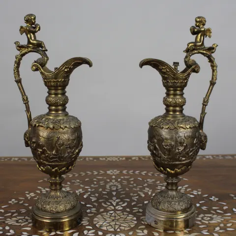 Pair of 19th Century French Gilt Bronze Bacchanalian Ewers with Cherubs