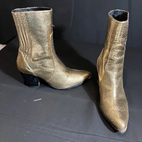 Zara Gold boots worn by Florence Hall
