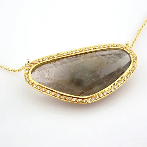 An exquisite necklace detailed with slice cut tourmaline,  brilliant diamonds and gold