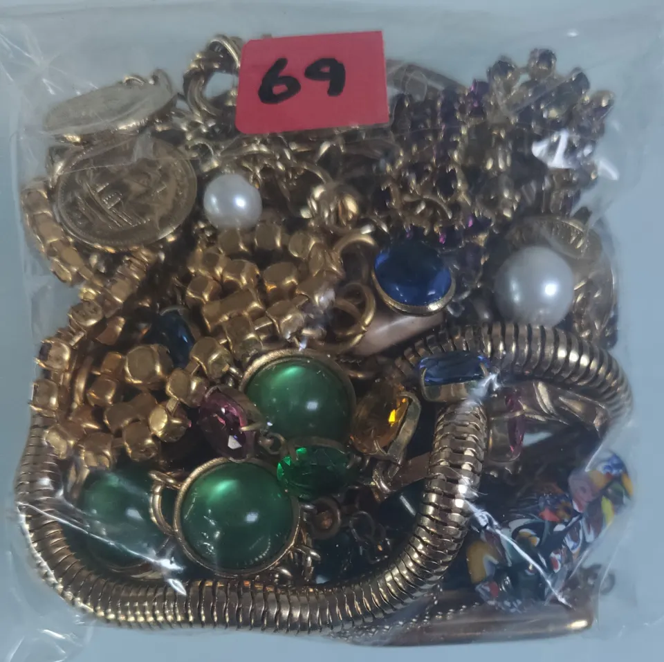 A collection of yellow metal jewellery in a bag. Approximately 380g.