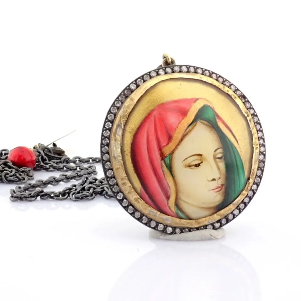 An exquisite necklace detailed with micro-art , brilliant diamonds and gold on silver
