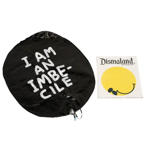 David Shrigley OBE (b 1968) ‘I Am An Imbecile’ Balloon, & Official Banksy Dismaland Programme, 2015