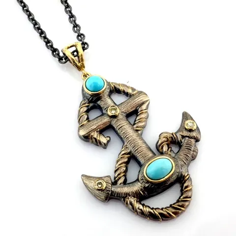 An exquisite anchot necklace detailed with turquosie, brilliant diamonds and gold on silver.