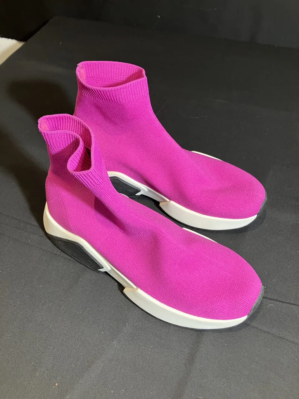 ASOS Pink Sock Trainers worn by a stunt double