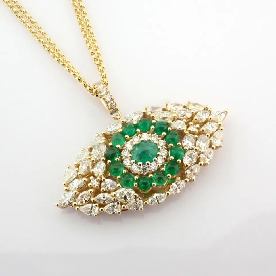 14K large evil eye necklace detailed with vibrand emerald and brilliant diamonds