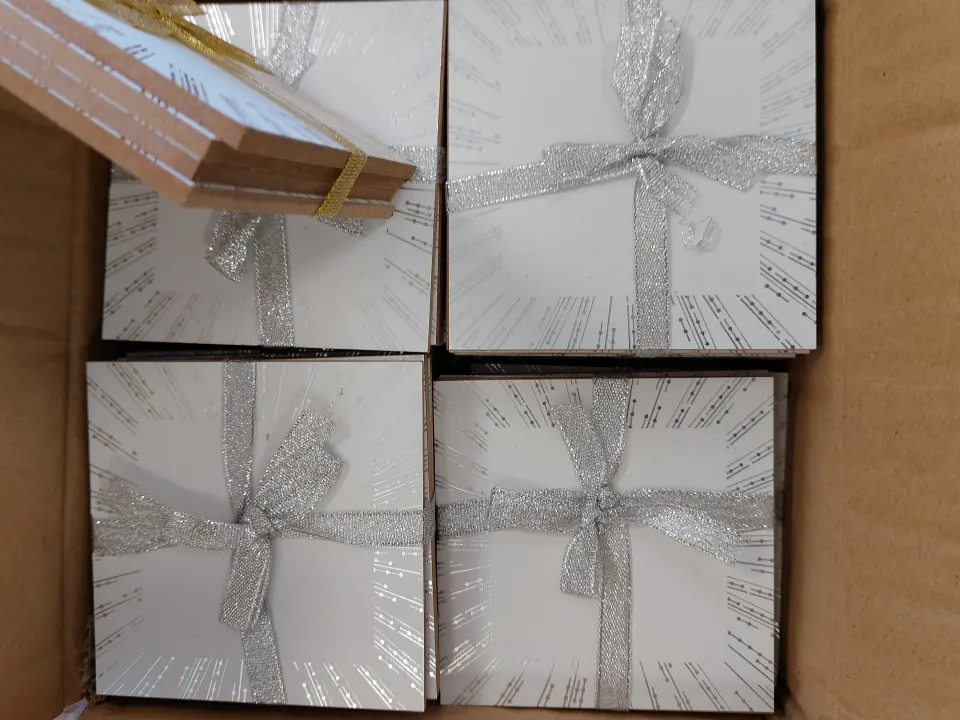 Box of 96 silver and gold edged coasters