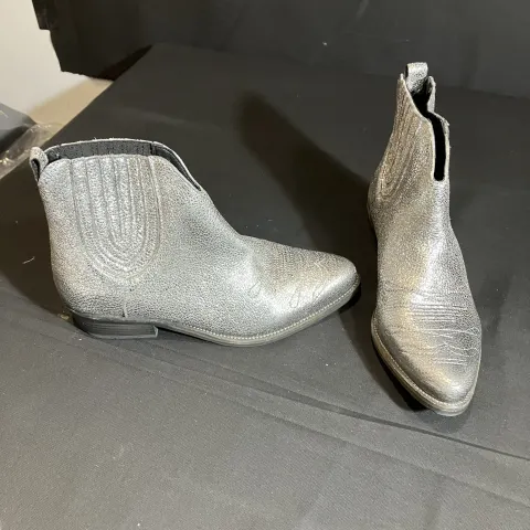 Hush silver boots worn by Mia Lloyd