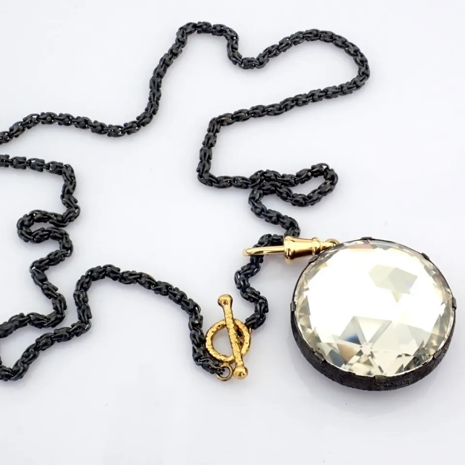 An Exquisite Necklace Detailed With White Topaz and Gold In Silver