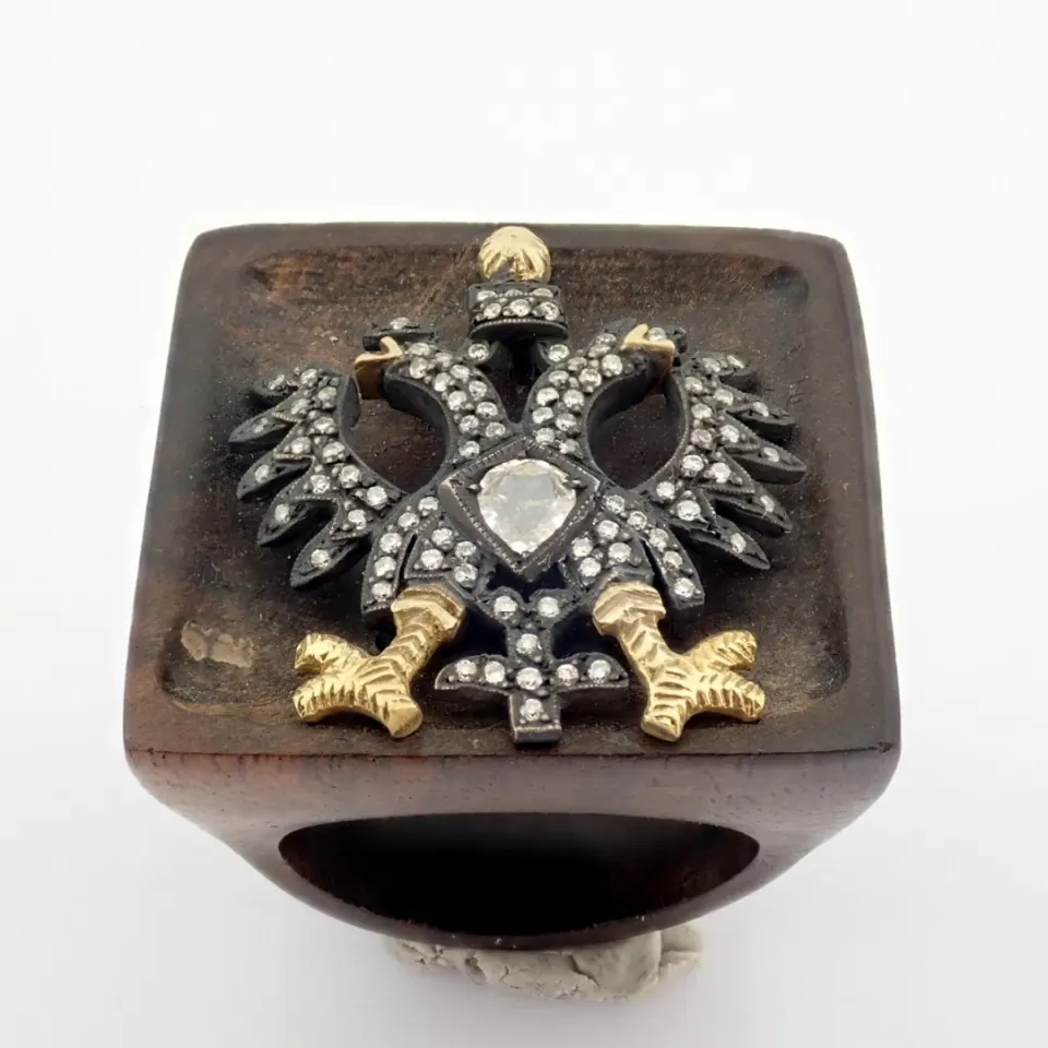 An exquisite  eagle ebony ring detailed with  brilliant diamonds and gold on silver.