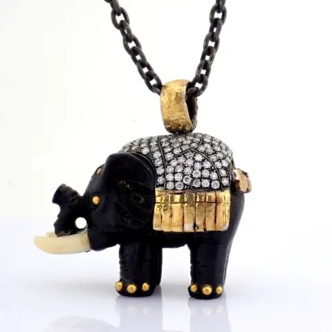 An Ebony-Carved Elephant Necklace Intricately Detailed With Brilliant Diamonds and Gold On Silver.