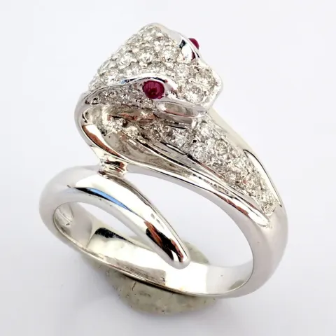 An exquisite snake ring intricately detailed with brilliant diamonds and 18k gold