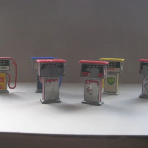 A Group of Six Vintage Metal Miniature Petrol Pumps