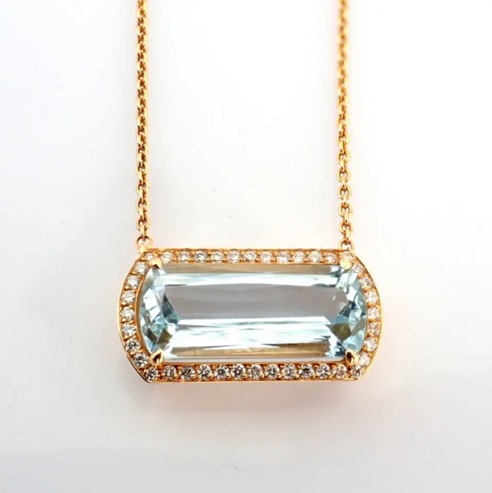 14K rose gold necklace detailed with aquamarine and brilliant diamonds