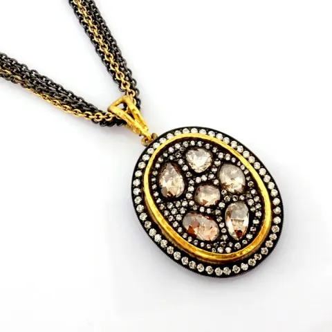 An exquisite necklace intricately detailed with .brilliant diamonds and gold  in silver