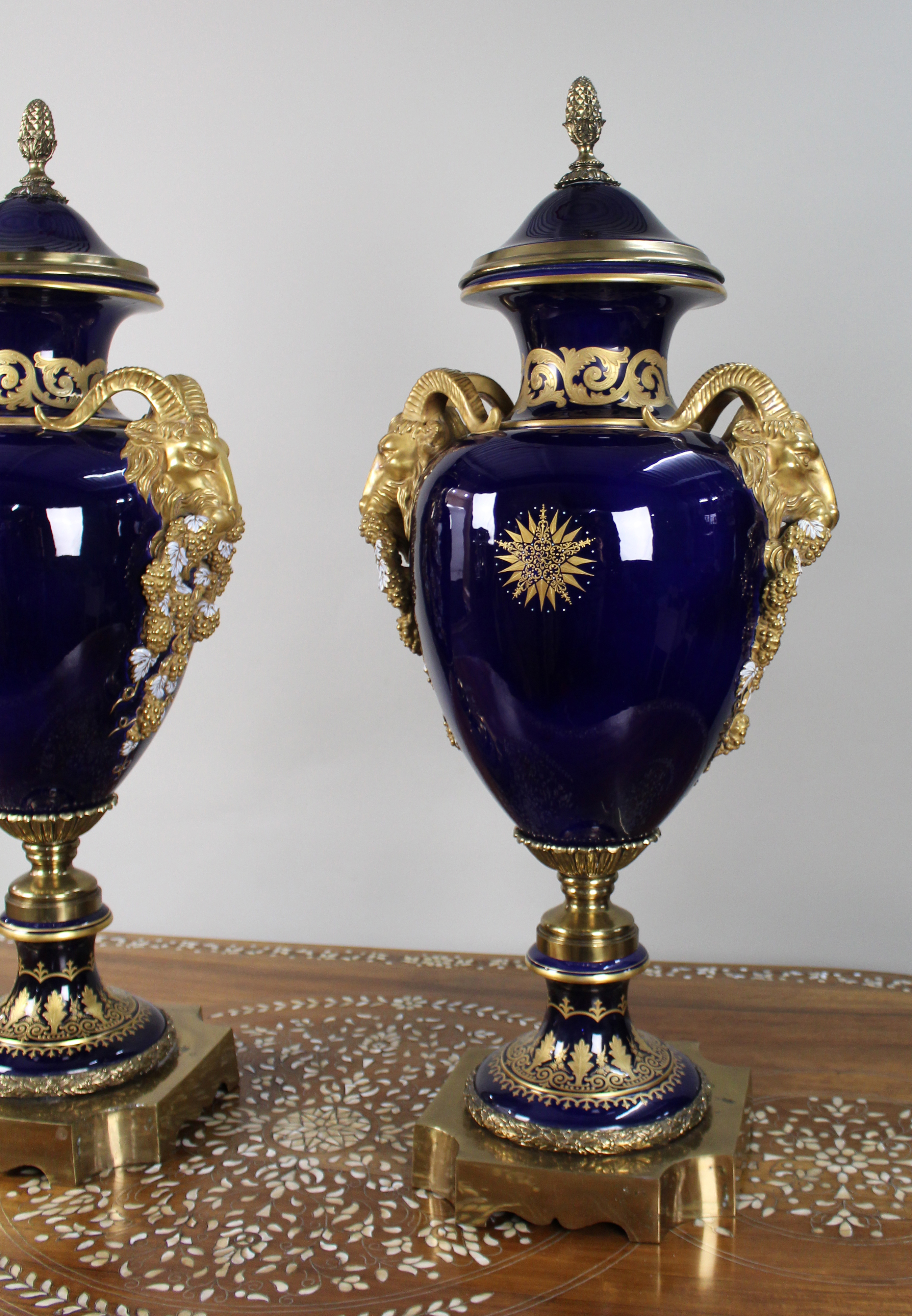 Pair of Fine Sevres Style Cobalt Blue Rams Head Lidded Urns
