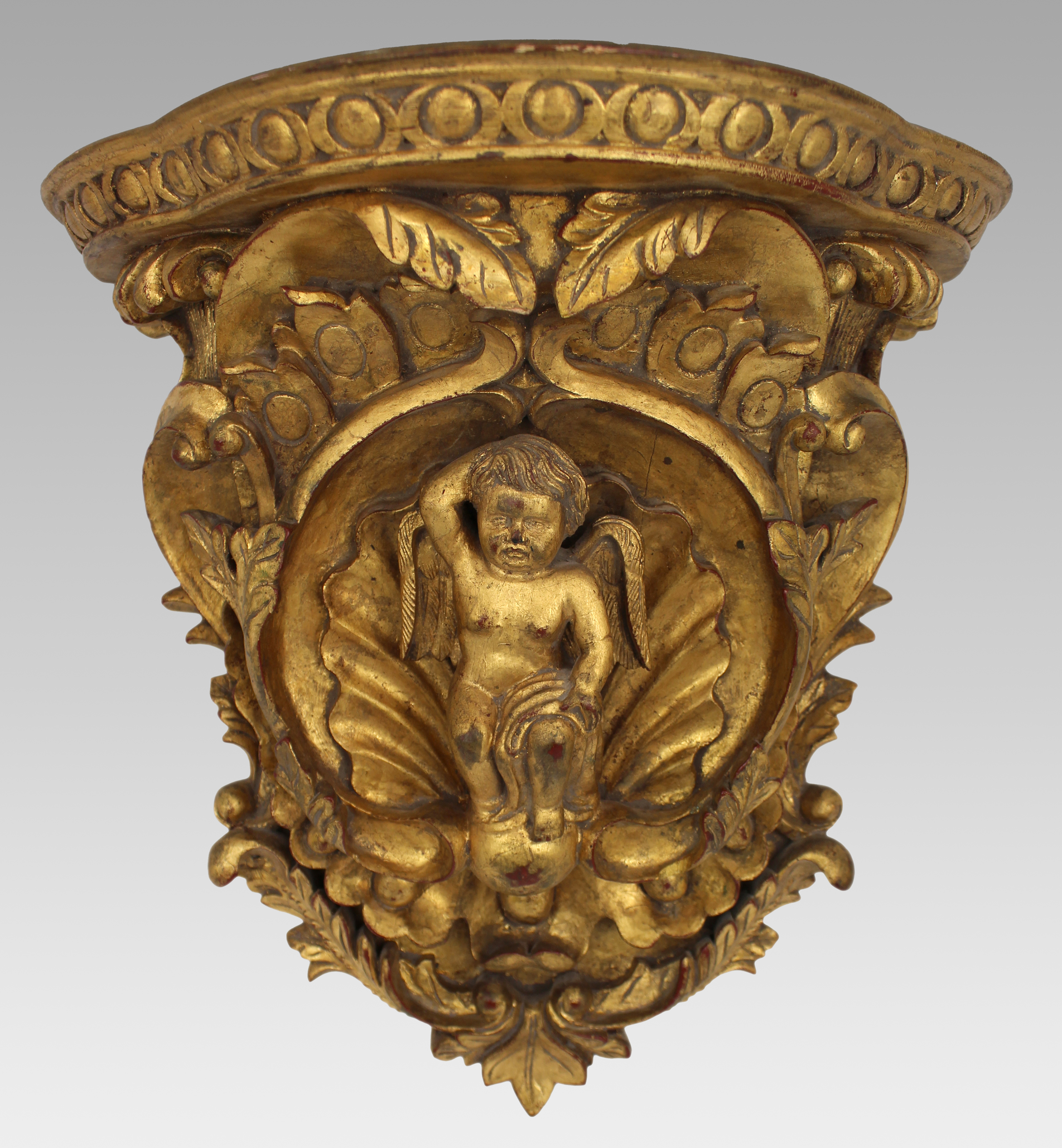 Pair of Carved Giltwood Wall Brackets with Cherub Motifs