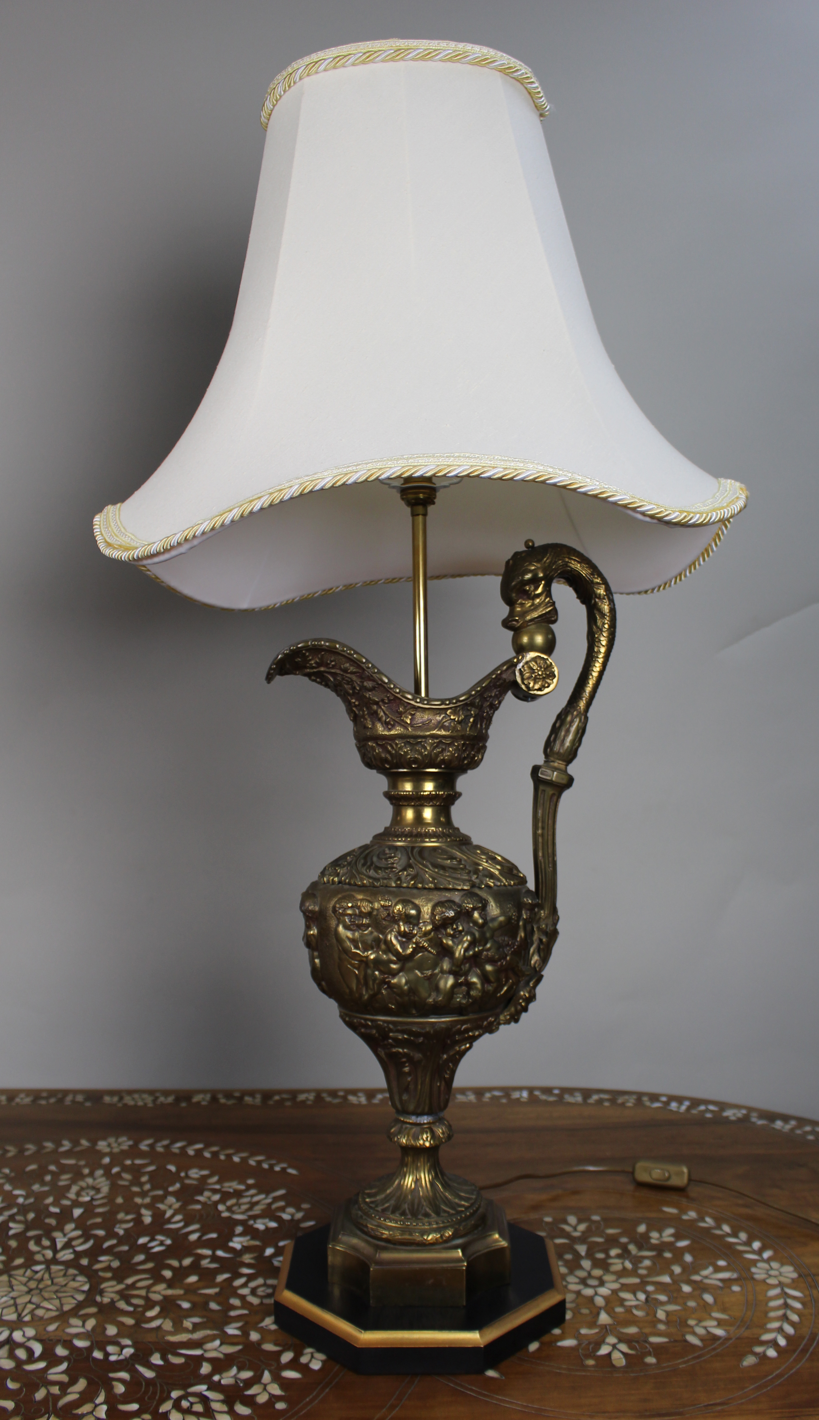 Pair of Early 20th Century French Neoclassical Ewer Lamps with Putti Relief