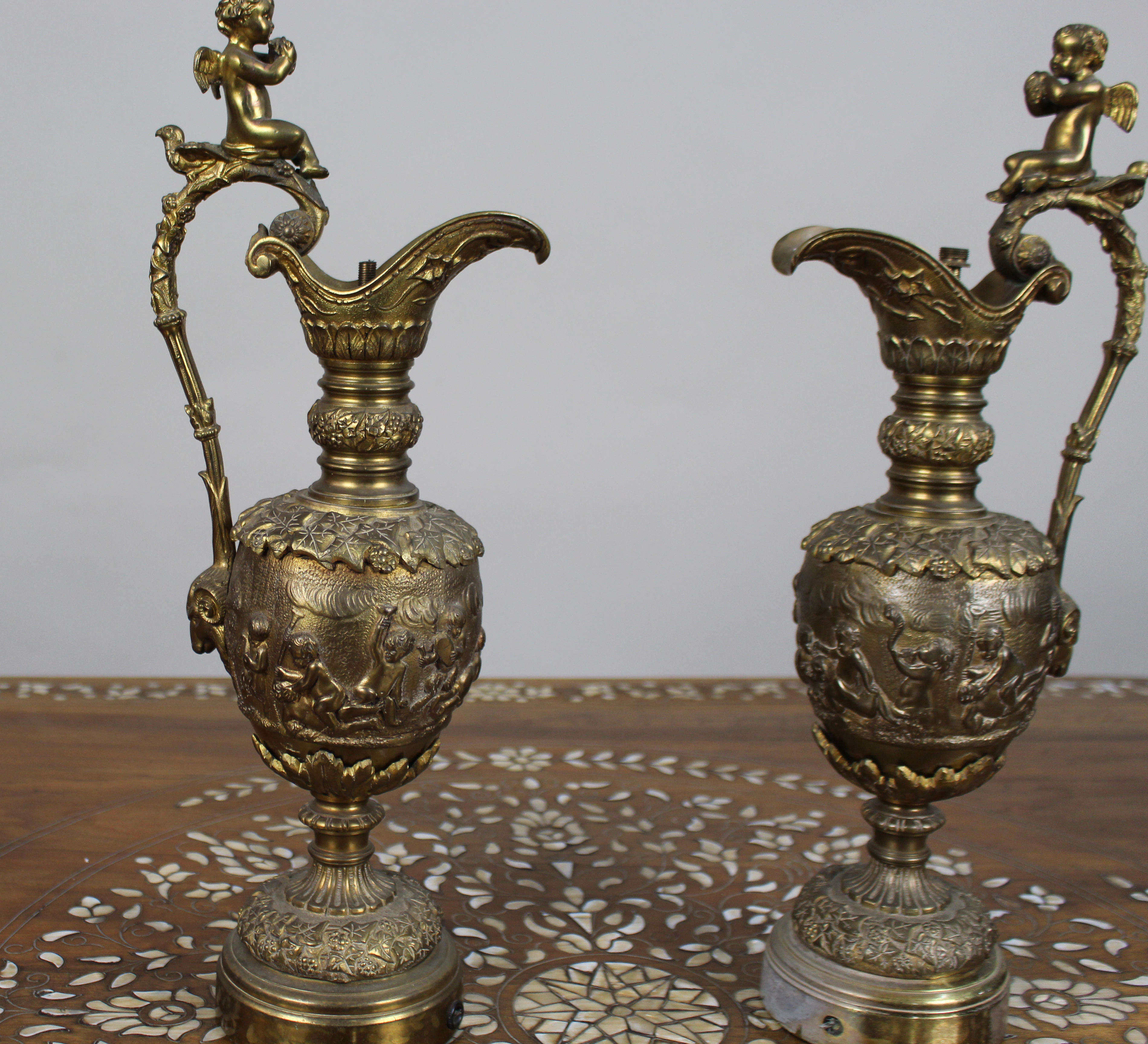 Pair of 19th Century French Gilt Bronze Bacchanalian Ewers with Cherubs
