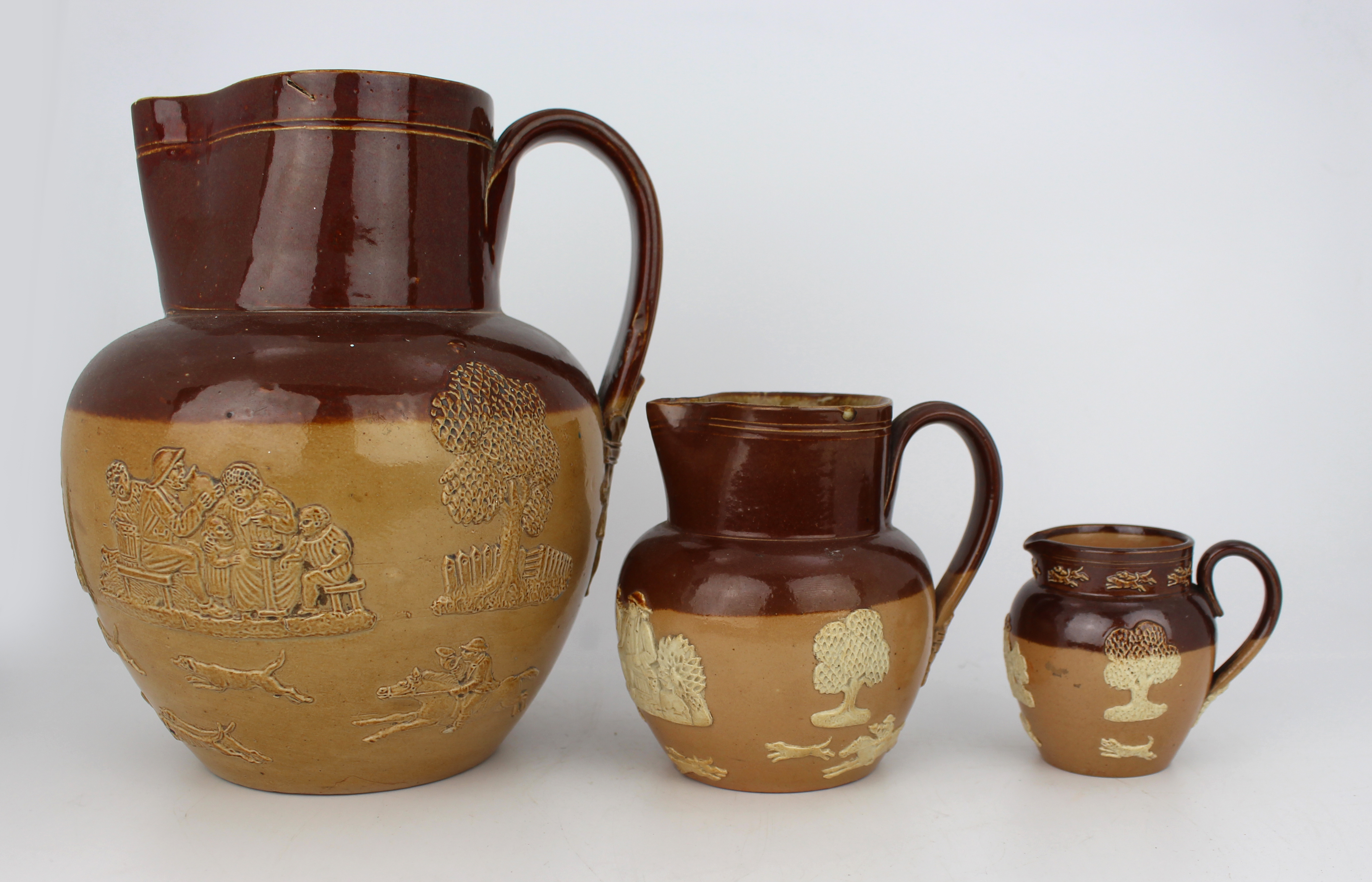 Collection of Three Graduated Doulton Lambeth Stoneware Jugs, c.1900