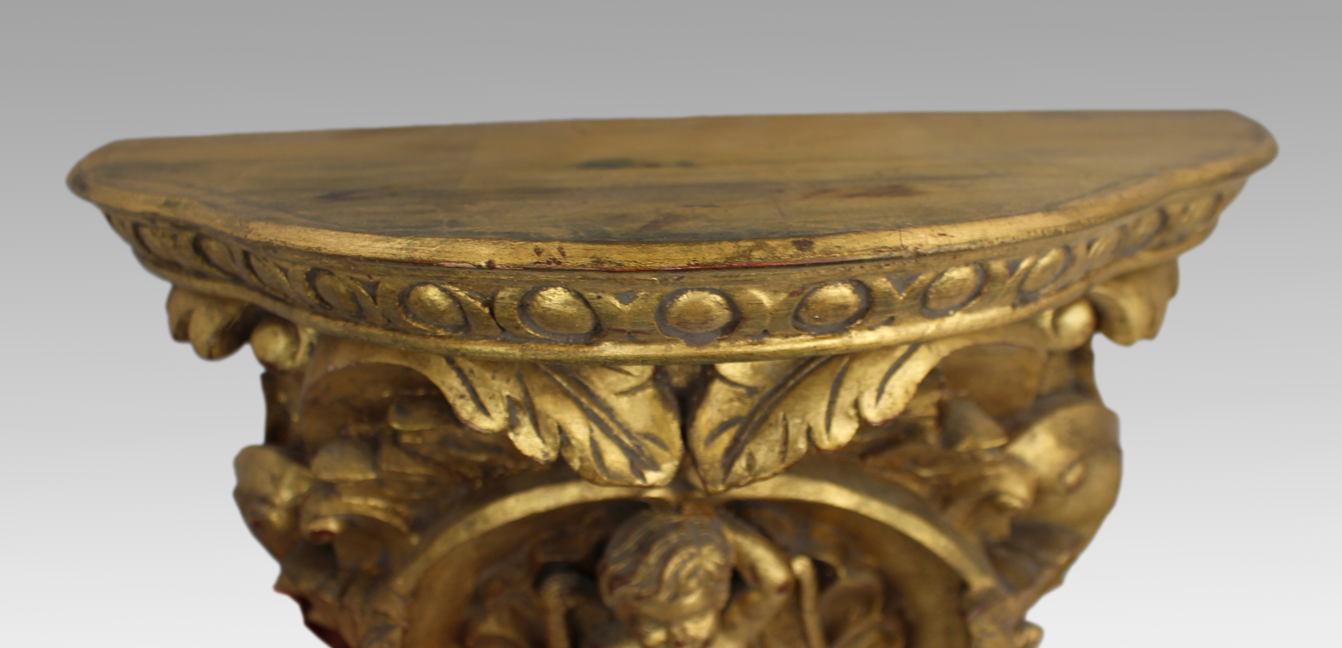 Pair of Carved Giltwood Wall Brackets with Cherub Motifs