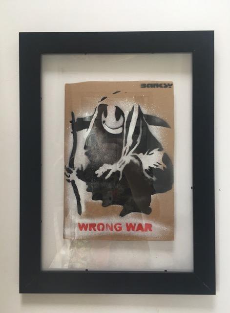 Banksy (b1974) ‘Wrong War’ & 6 Dismaland Bemusement Park Souvenirs Inc Framed Banksy Free Art, 2015